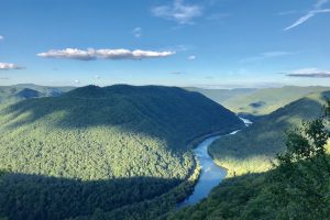 Picture of river curving through green Appalachian mountains