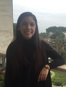 Picture of Kelsey Flores leaning against a railing
