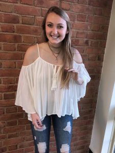 A picture of Elizabeth Wood against a brick wall